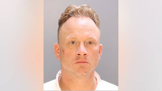 Woman killed when struck in chest with crossbow, husband arrested