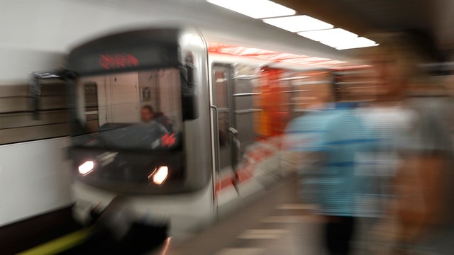 Travel race contestants drive Prague subway train