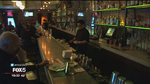 After minimum wage hike, many New York restaurants cut workers' hours