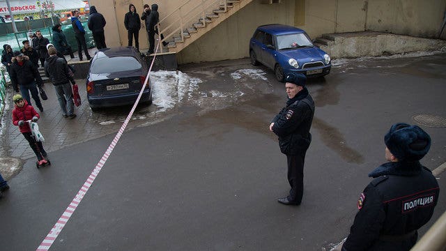 Burka-clad woman waves child's severed head
