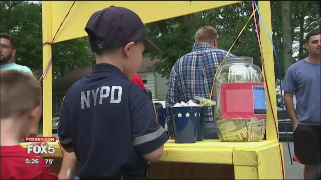 Boys sell lemonade to help families of fallen cops and firefighters