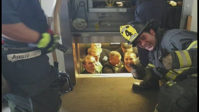 Firefighters rescue police stuck in elevator