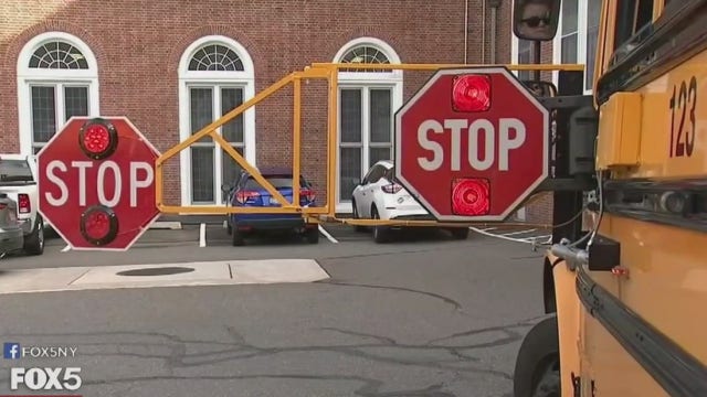 Schools hope cars will stop for buses with extra-long stop sign arms