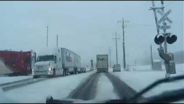 VIDEO: Train smashes into FedEx truck