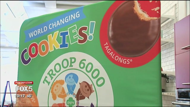 Troop of Girl Scouts from shelters is on a special cookie mission