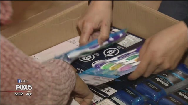Volunteers pack aid boxes for Venezuela