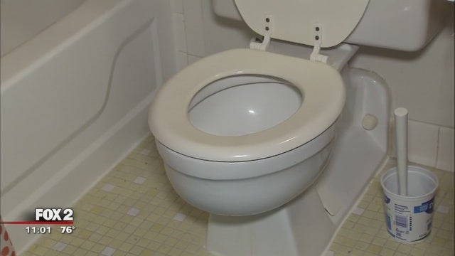 Man accused of flushing grandparents' ashes down toilet