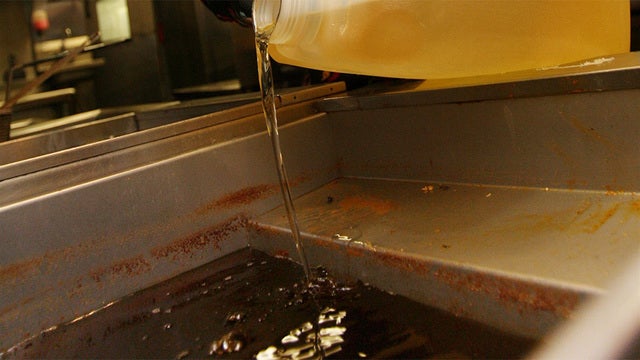 Woman sues over husband's death after fall into fryer