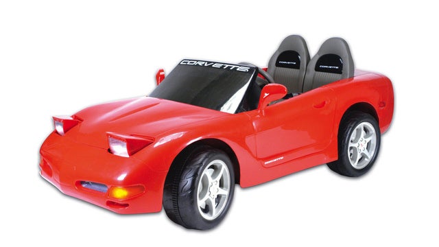 Toddler takes late-night drive on street in toy car