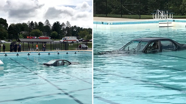 Driver lands car in swimming pool during parking practice, police say