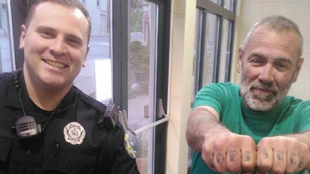 Cop poses with man's anti-cop tattoos
