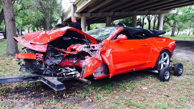 Distracted driver unhurt after car's 50-foot plunge
