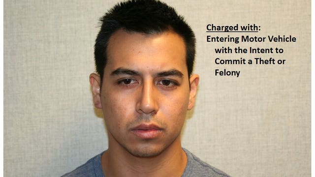 Police: Man arrested after crouching in woman's car