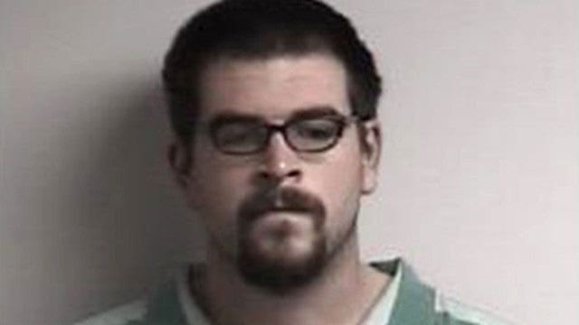 Doughnut-eating champ charged with stealing from Dunkin' Donuts