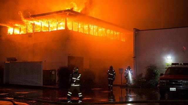 Flames spew from fire station while crew is away