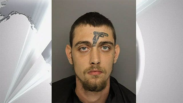 Man with gun tattoo on face arrested for illegal gun