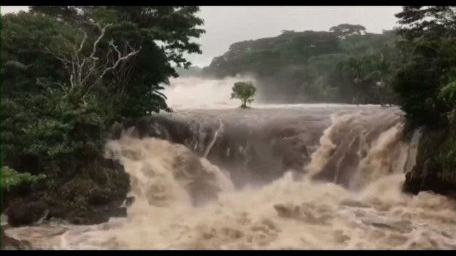 Hurricane Lane floods homes in Hawaii as some swim in powerful waves