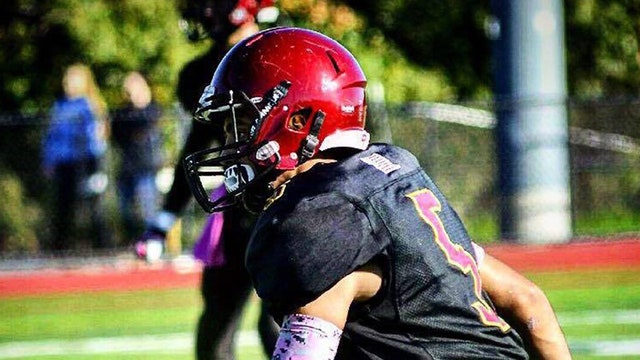 Family of teen killed in football log drill sues school district, team