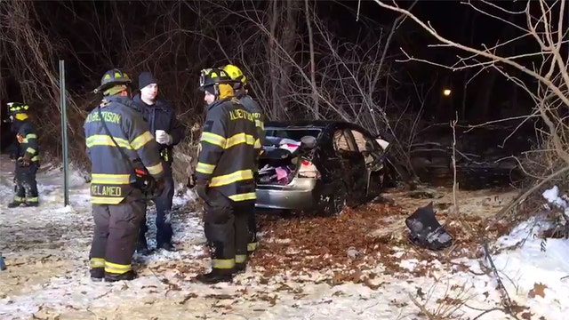 Car plunges into pond in Long Island