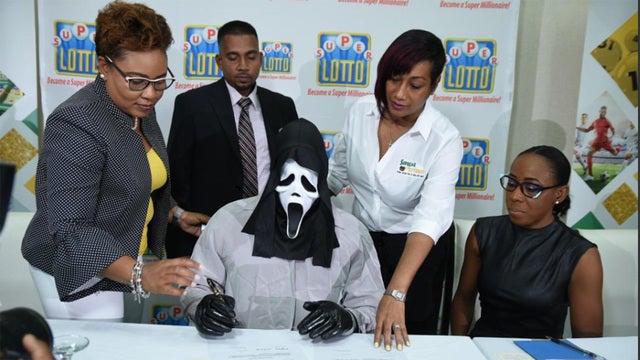 Man accepts lottery jackpot in 'Scream' mask