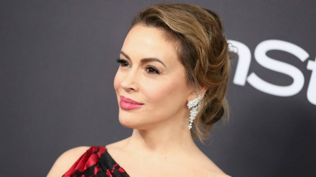 Alyssa Milano: 'The red MAGA hat is the new white hood'