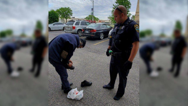 Illinois police officer takes off shoes, gives them to homeless man