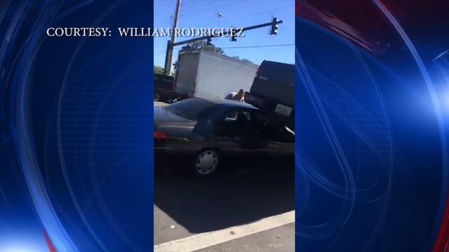 Police: Driver of truck backs over car in road rage incident