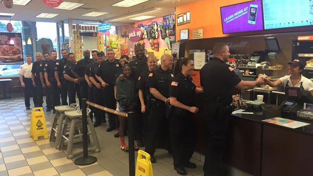 PHOTO: Ossining police officers line up for National Doughnut Day