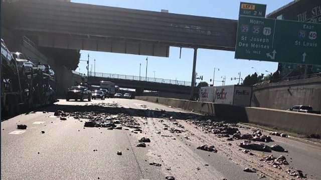 ‘Hold your noses': Big rig spills foul-smelling pig guts all over interstate