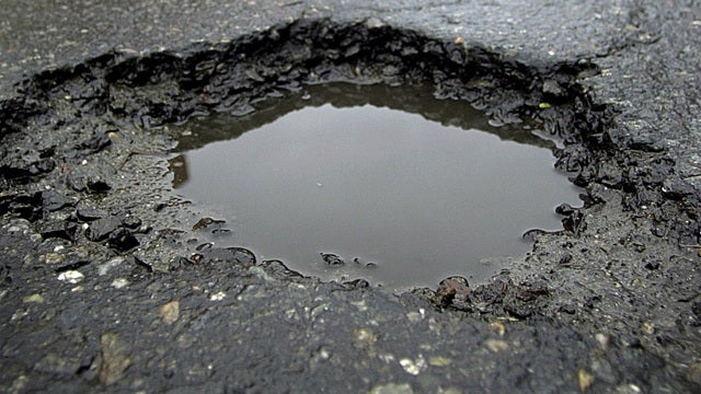 Priest pleads for divine intervention to fix potholes