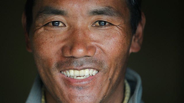 Sherpa guide scales Everest for record 22nd time