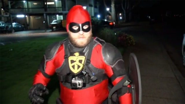 Masked man in tights looks for bad guys