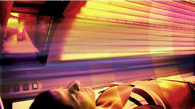 Woman robbed in tanning bed