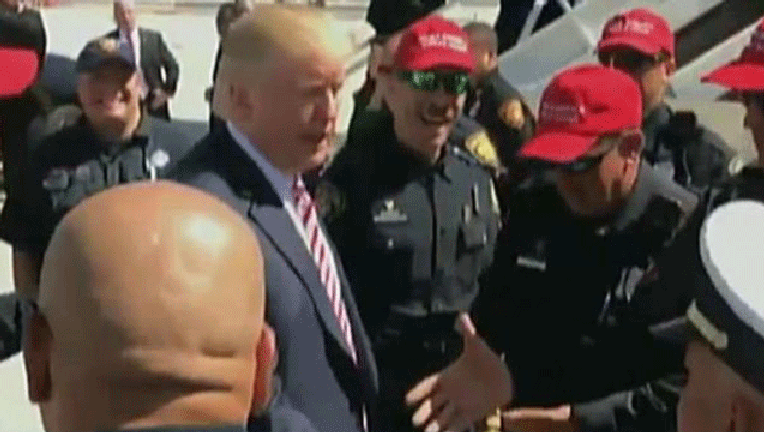 Cops-wearing-Trump-hats_1476296919687-407693.gif
