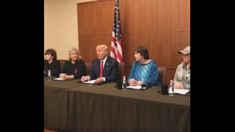 trump_with_clinton_victims_1476056826996-401720.png