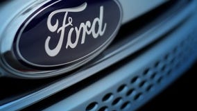 Ford profit plunges on slower sales, pension costs