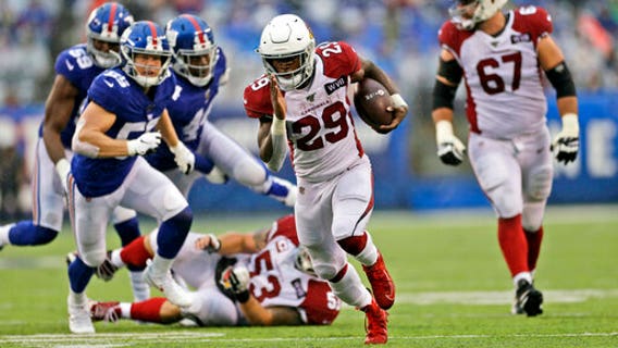 Edmonds runs for 3 TDs, Cards top Giants in Barkley's return
