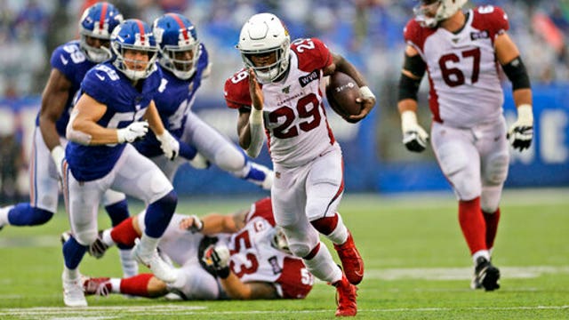 Edmonds runs for 3 TDs, Cards top Giants in Barkley's return