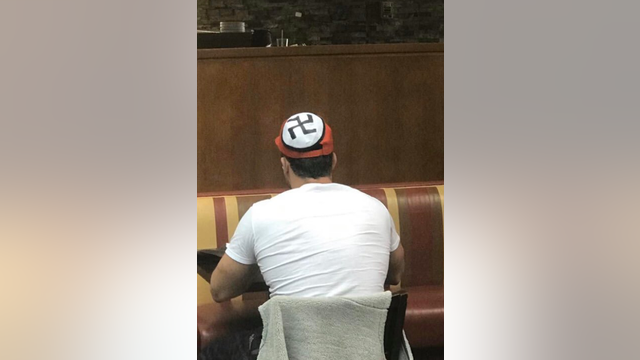 Man wears hat with swastika into NY diner