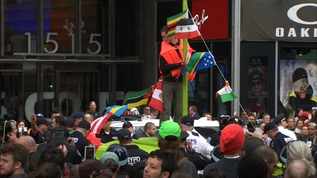 Climate change protesters block Times Square with boat
