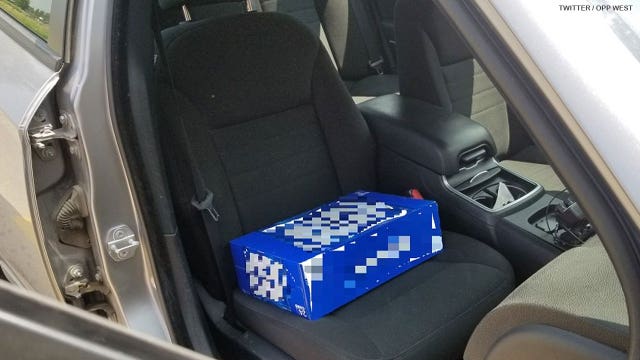 Man charged for allegedly trying to use case of beer as booster seat for toddler