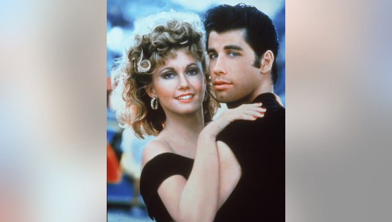 Actors John Travolta and Olivia Newton-John embrace in a promotional still for the film, 'Grease,' directed by Randal Kleiser, 1978. (Photo by Paramount Pictures/Fotos International/Getty Images)