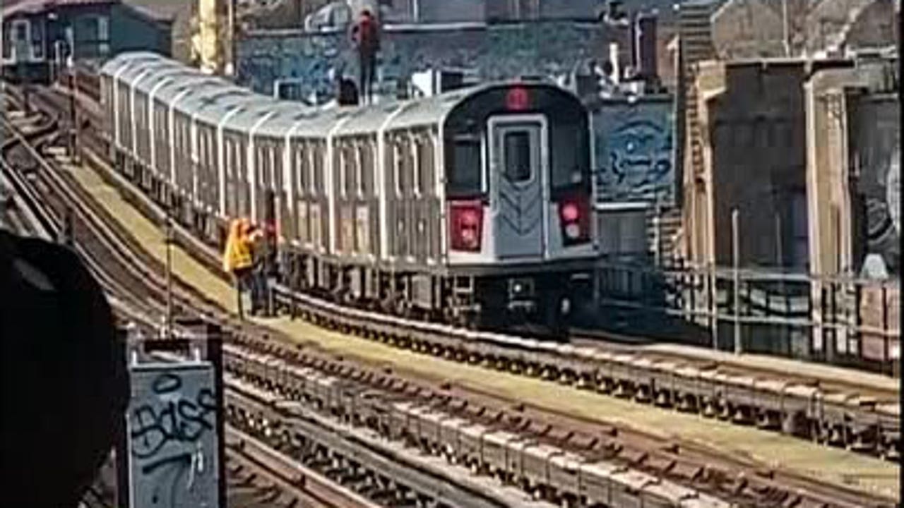 VIDEO: Two men seen subway surfing in Queens