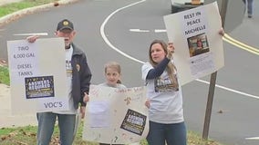 Families protest outside a school they say is making people sick