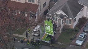 Delivery truck crashes into house on Staten Island