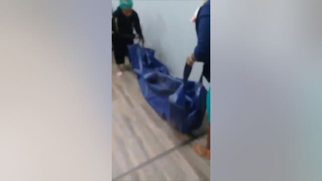 Body bag carried into insurance company as 'proof of death'