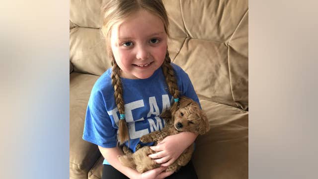 Terminally ill girl who went viral as dog lover dies after battle with brain tumor