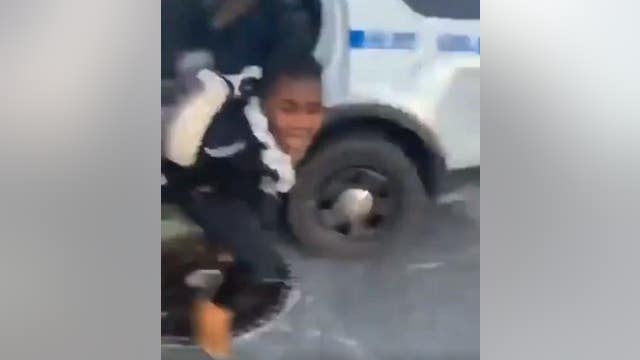 Teen accused of helping handcuffed suspect escape police car