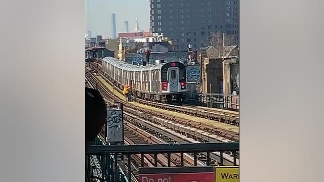 VIDEO: Two men seen subway surfing in Queens