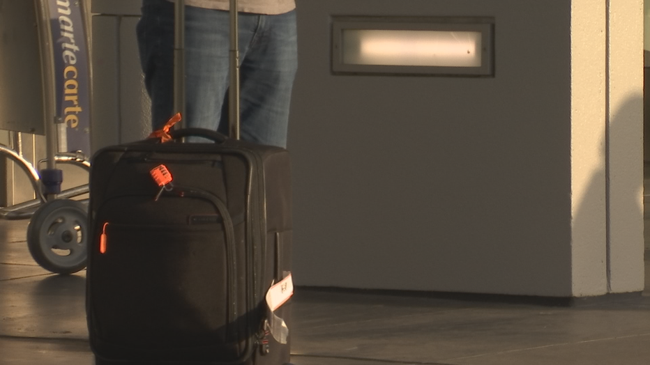 FILE ART - A man waits at San Francisco International Airport.